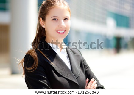 Portrait of a smiling businesswoman in urban setting