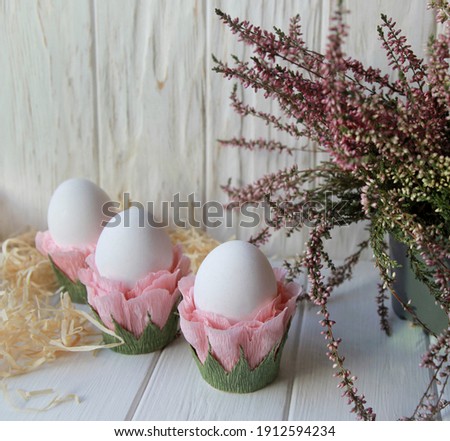 Festive spring decor, easter composition with eggs and pink flowers