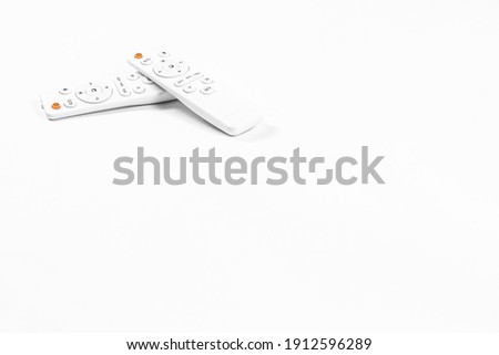 White  unbranded universal remote control on white background