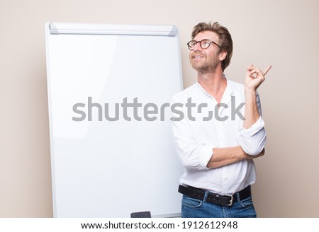 adult blonde businessman with a board