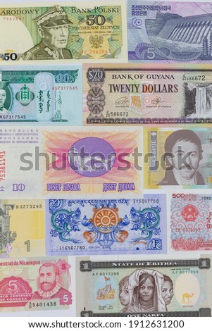 Banknotes from different countries as background from different times lined up in verticalformat. Colorful
