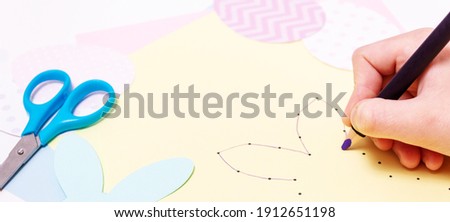 Easter activities. Dot to dot painting bunny game. Line art easter rabbit game for children. Dot to dot drawing activity page. Selective focus. Top view. banner.  Royalty-Free Stock Photo #1912651198