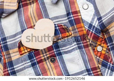 valentine card concept. heart symbol at shirt pocket. above view. shopping conceptual.