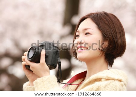 Image of a woman taking a picture 
