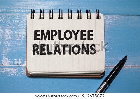 Employee Relations, text words typography written on book against wooden background, life and business motivational inspirational concept Royalty-Free Stock Photo #1912675072