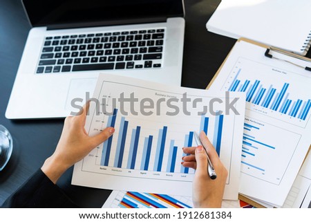 top view of Business consultant meeting to analyze and discuss company performance On financial report paper Investment advisor, financial advisor, and accounting concept Royalty-Free Stock Photo #1912681384