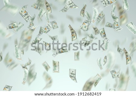One hundred dollar bills are falling. Isolated on a light background. A blank for using money concepts