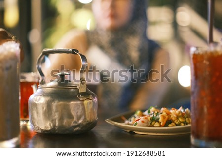 Ancient style red tea and old tea pot pattern bokeh and blur background