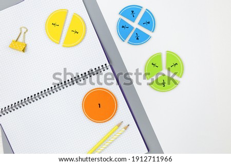 Creative trendy colors math fractions, notepad on yellow gray background. Interesting funny math for kids. Education, back to school concept. Geometry and mathematics materials. Flat lay, top view	