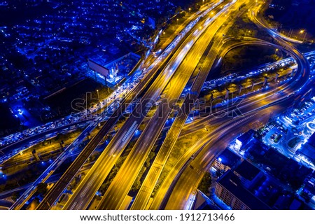 Aerial view of smart transportation with Expressway, Road and Roundabout, multilevel junction traffic highway-Top view. Important infrastructure smart architectur and transport in big city.