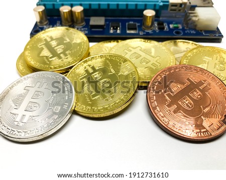Bitcoin with electronic circuit board and white background 