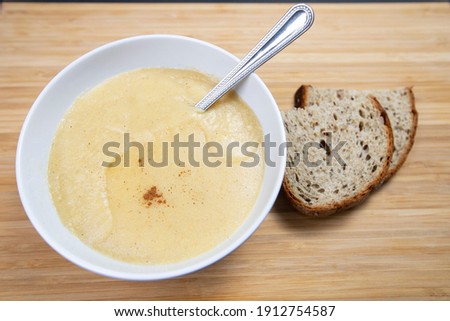 Bowl of Cornmeal Porridge with spoon, Top Down View selective focus.