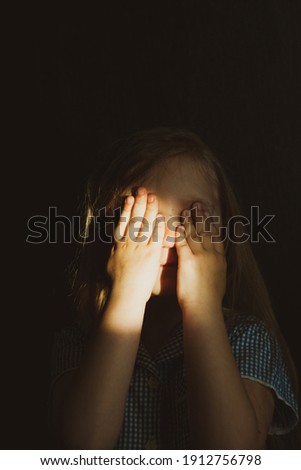 Little pretty girl smiling with sunny bunny on face. Cute child with blue eyes laughing. Long blond hair. Vintage lens kids home portrait in daylight. Growing up psychology personal development. Royalty-Free Stock Photo #1912756798