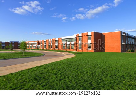 modern school building with lawn Royalty-Free Stock Photo #191276132