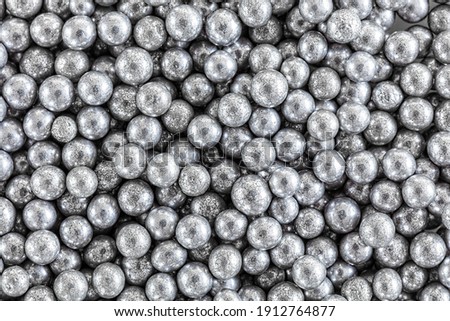Sprinkles silver ball confections seamless background, top view