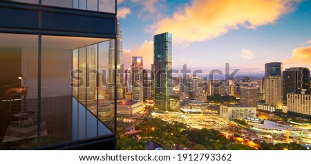 Panoramic view of beautiful evening cityscape with modern 3d rendering office exterior of skyscraper.