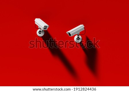 two outdoor surveillance cameras on a red wall, security system, web banner or template