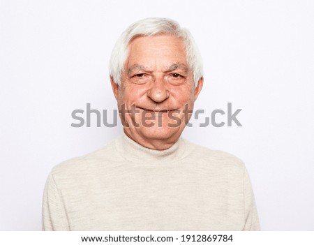 Close up portrait of happy senior man Royalty-Free Stock Photo #1912869784