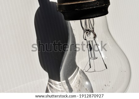 photo of close up of light bulb on white background
