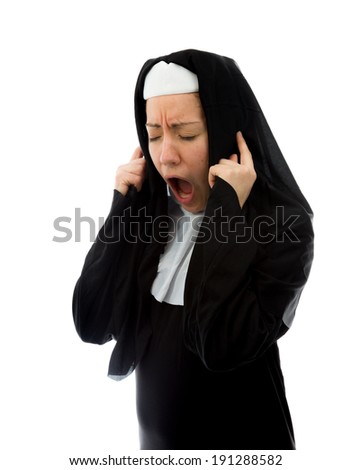 Young nun shouting with fingers in her ears