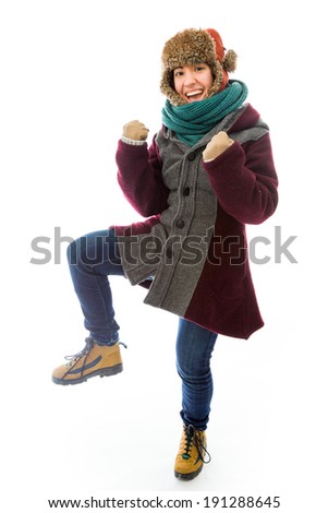 Young woman in warm clothing and gesturing