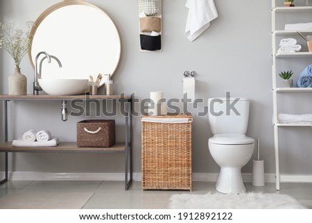 Stylish interior of modern bathroom with toilet bowl Royalty-Free Stock Photo #1912892122