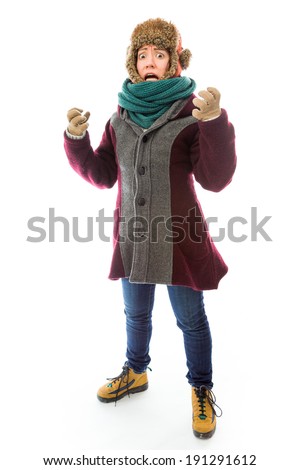 Frustrated young woman in warm clothing