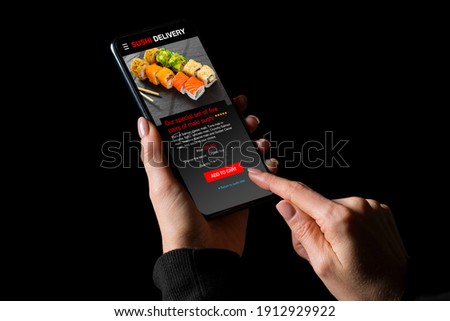 Woman ordering sushi on mobile phone for home delivery