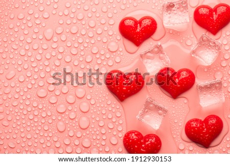 Happy valentines day concept. Top above overhead close up view photo of red hearts and ice cubes on light pink background with drops