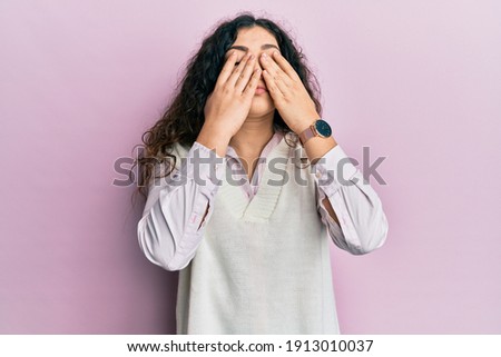 Young brunette woman with curly hair wearing casual clothes rubbing eyes for fatigue and headache, sleepy and tired expression. vision problem 