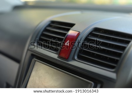 A close-up photo of car panic (emergency) button