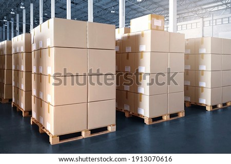 Interior of storage warehouse with packaging boxes stacked on pallet rack. shipping distribution warehouse. Supply chain. cargo shipment export- import. storehouse storage. Logistics Royalty-Free Stock Photo #1913070616