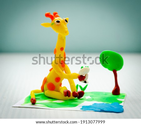 children's creativity, bright plasticine giraffe