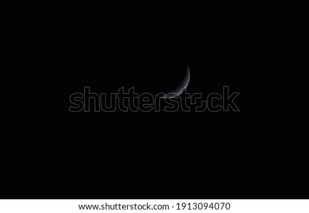 Beautiful picture of half moon is isolated on black sky. Selective Focus On Subject