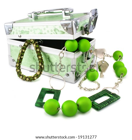 Light green trunk, beads and armlet isolated on a white background
