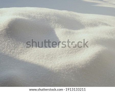 Winter picture with a closed snow cover, using as seasonal background, cold sunny day