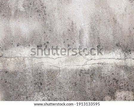 This image of a concrete wall under construction and an unpainted surface depicts the gliding of an unfinished construction wall. Use it as a background image. 