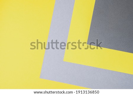 Gray and yellow paper top view. Template with geometric shapes for design in trendy colors of the year with place for text
