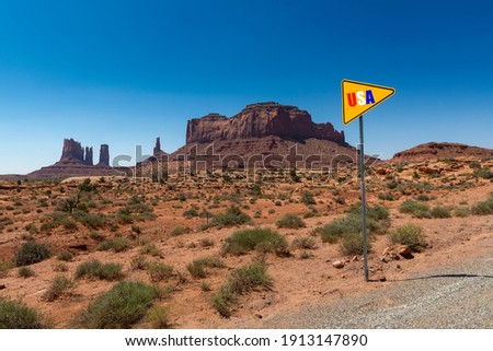 Scenic view of the Monument Valley with the sandstone buttes; Concept for travel in the USA and road trip.