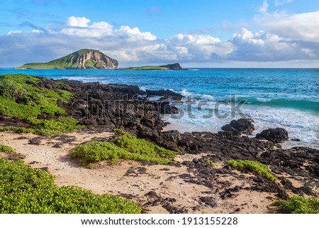 rocks close to Macapuu beach with Manana (also known Rabbit island) and Kaohikaipu islands in background, Oahu, Hawaii