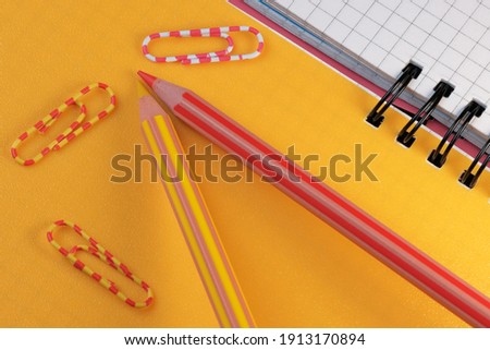 Composition art layout with loose-leaf notebook with yellow cover close-up
