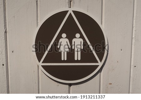 Exterior restroom sign that represents both male and female.                                