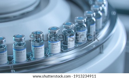 SARS-COV-2 COVID-19 Coronavirus Vaccine Mass Production in Laboratory, Bottles with Branded Labels Move on Pharmaceutical Conveyor Belt in Research Lab. Medicine Against SARS-CoV-2. Royalty-Free Stock Photo #1913234911