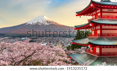 Fujiyoshida, Japan at Chureito Pagoda and Mt. Fuji in the spring with cherry blossoms. Royalty-Free Stock Photo #1913235172