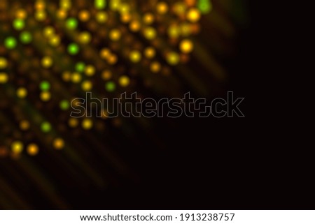 Bokeh on a black background. Photo decoration element. Side bokeh in the corner.