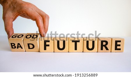 Good or bad future symbol. Businessman turns wooden cubes and changes words 'bad future' to 'good future'. Beautiful white background, copy space. Business and bad or good future concept.