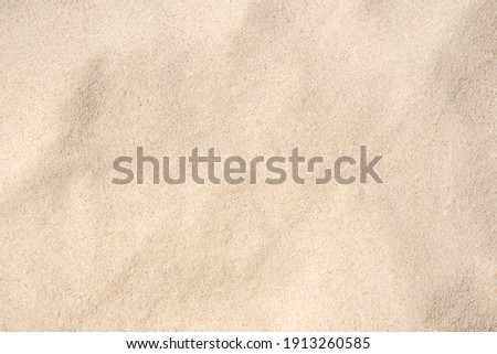 Sand Texture. Brown sand. Background from fine sand. Close-up image. Royalty-Free Stock Photo #1913260585