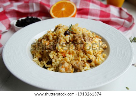 Gluten Free Rice Risotto With Turkey Grapes Cinnamon and Cashew