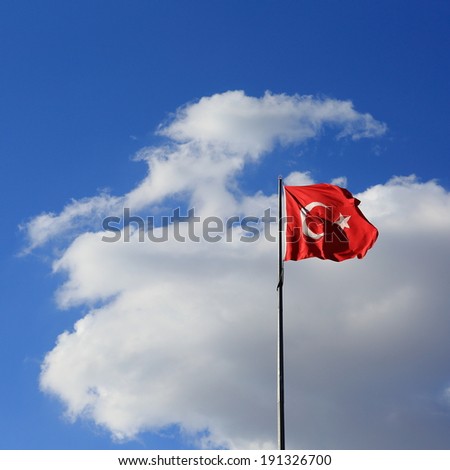 Waving flag of Turkey under sunny blue sky Royalty-Free Stock Photo #191326700