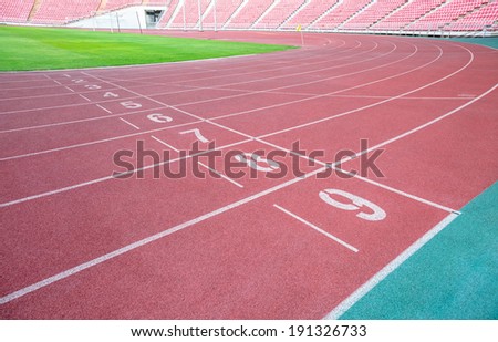 Numbers on red running track 